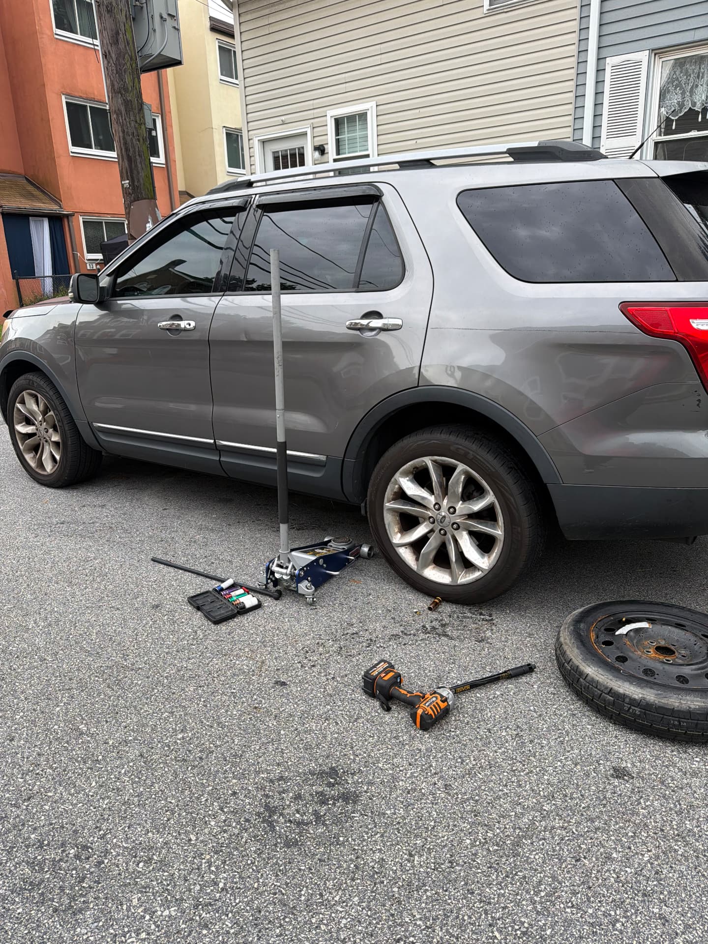 Spare tire installed on a Ford Explorer curbside